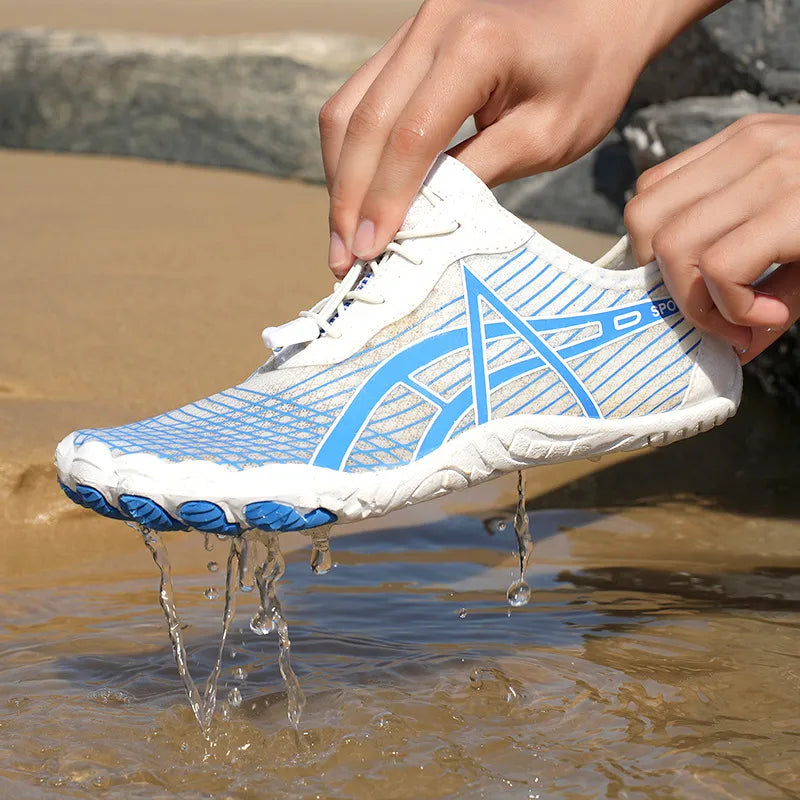 Elastic Lock Laces Mesh Breathable Hike Footwear being splashed with water on the beach.