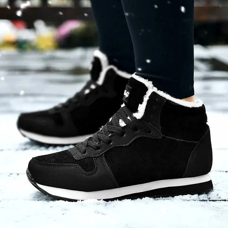Men Waterproof Winter Boots – Warm Plush Non-Slip Snow Shoes in black worn in the snow on a winter day.