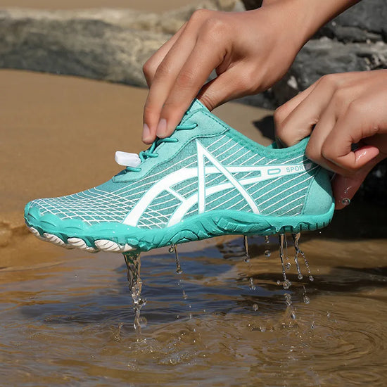 Elastic Lock Laces Mesh Breathable Hike Footwear being held over water, showcasing its water-friendly design.